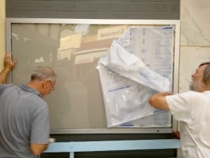 Trevor. Luke & Peter Put Up New Community Notice Board