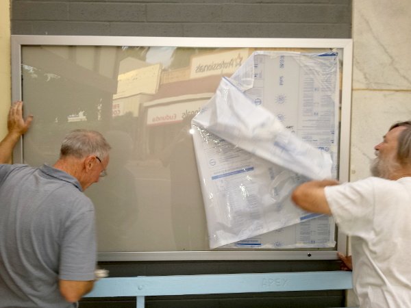 Trevor. Luke & Peter Put Up New Community Notice Board 